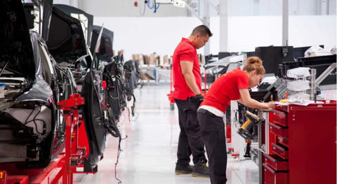 A Tesla employee at work