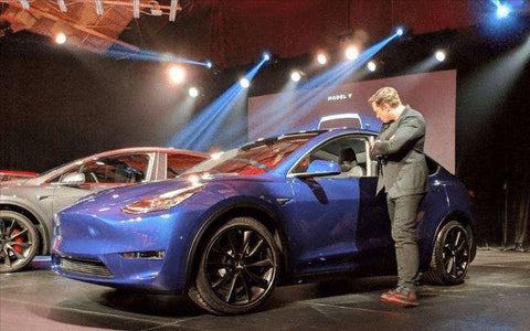Musk and Tesla model 3