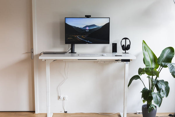 Minimalist white home office desk setup base on Maidesite T2 Pro Plus height adjustable desk frame