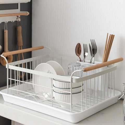 large wood handle dish drying rack with a removable tray.