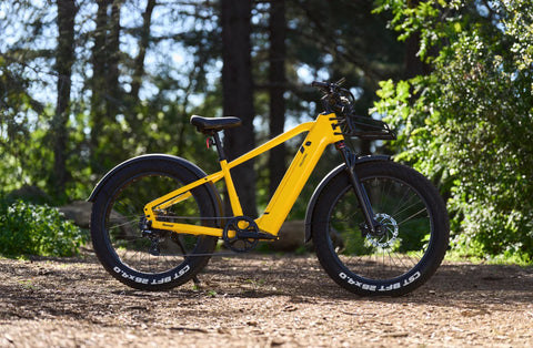 Velotric Yellow N1 Fat Tire Ebikes in the forest