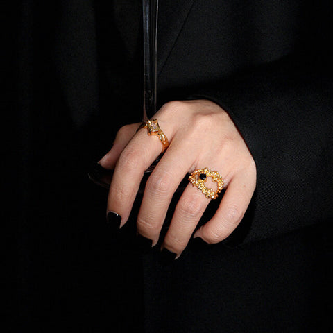 Gold ring with black stone