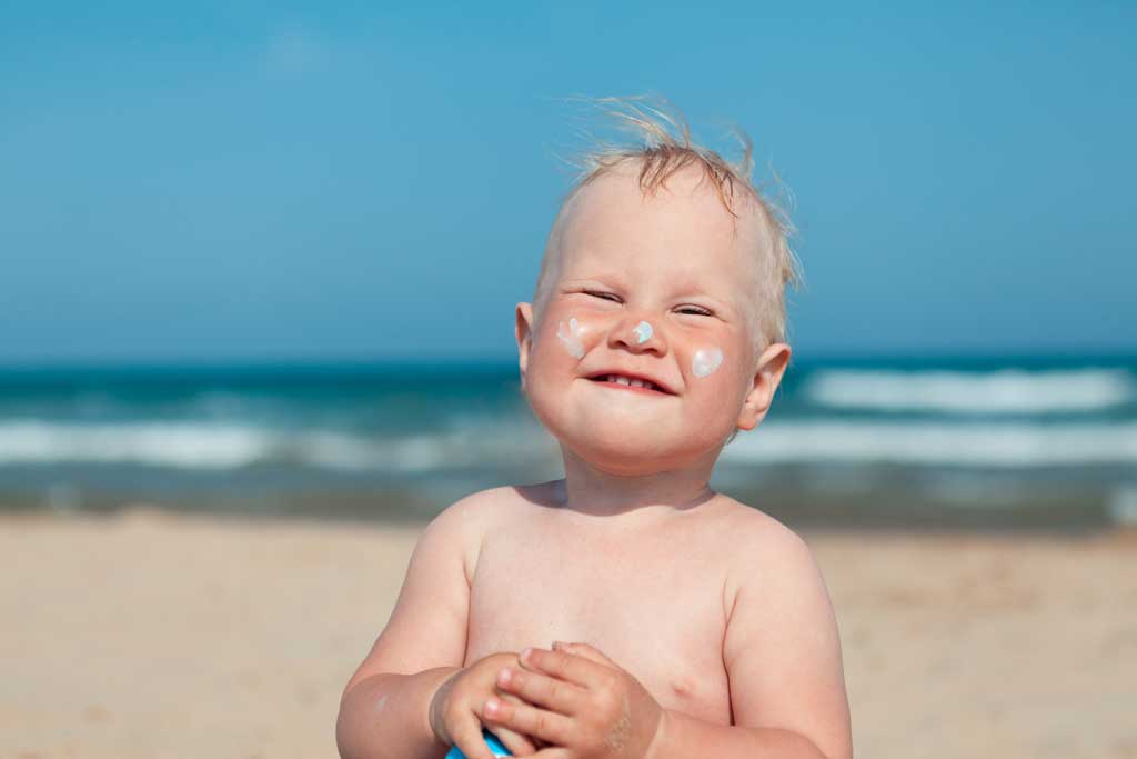 sunscreen baby on the beach