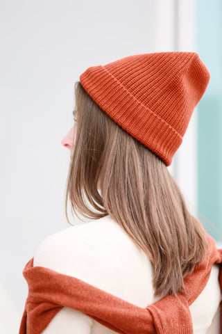 capsule wardrobe style sweater winter hat orange merino wool cashmere sweater cardigan