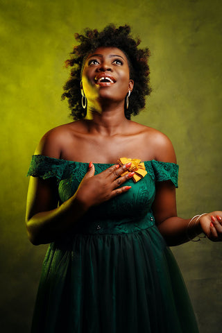 Warm skin and olive dress