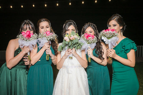 Bridesmaid dresses in different shades of the same colour