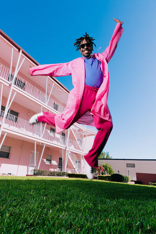 groom in the pink suit