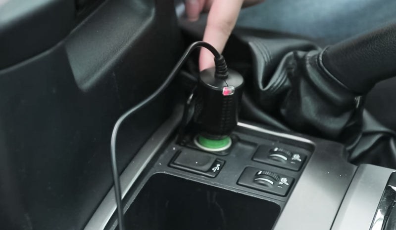 Plug into the cigarette power socket