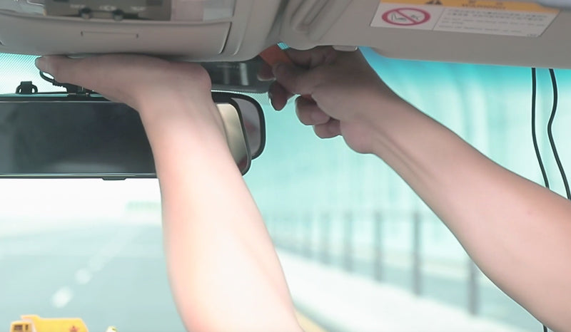 Use a crowbar to hide the connecting wire above the windshield.