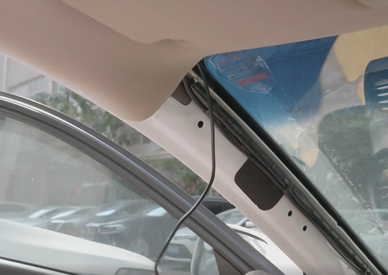 run the power cord under the weather sealing of the door frame