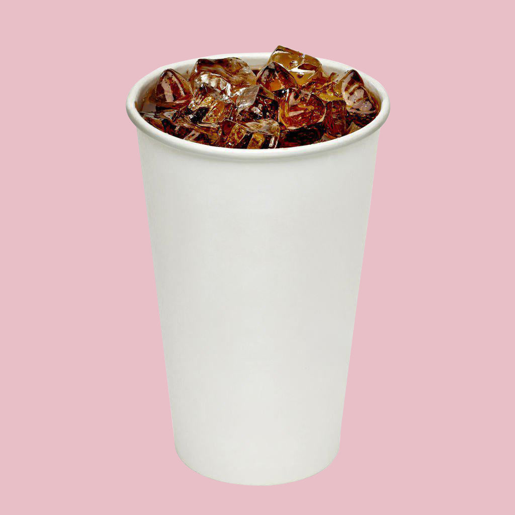 A Paper Coke Cup filled with coke and ice cubes, set against a soft pink background.