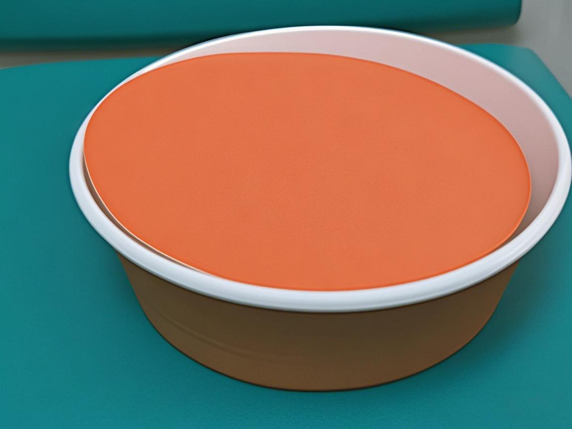 An orange paper bowl with a white inner rim and matching lid sits on a teal surface; a clean, simple food packaging design.