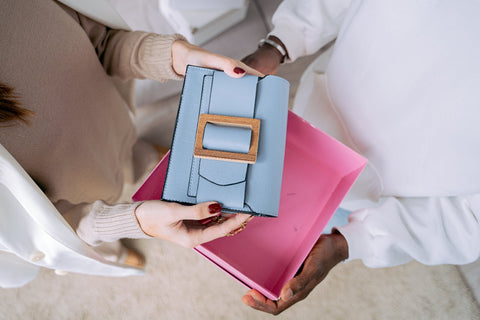 A man are gifting a handbag at Valentine's Day