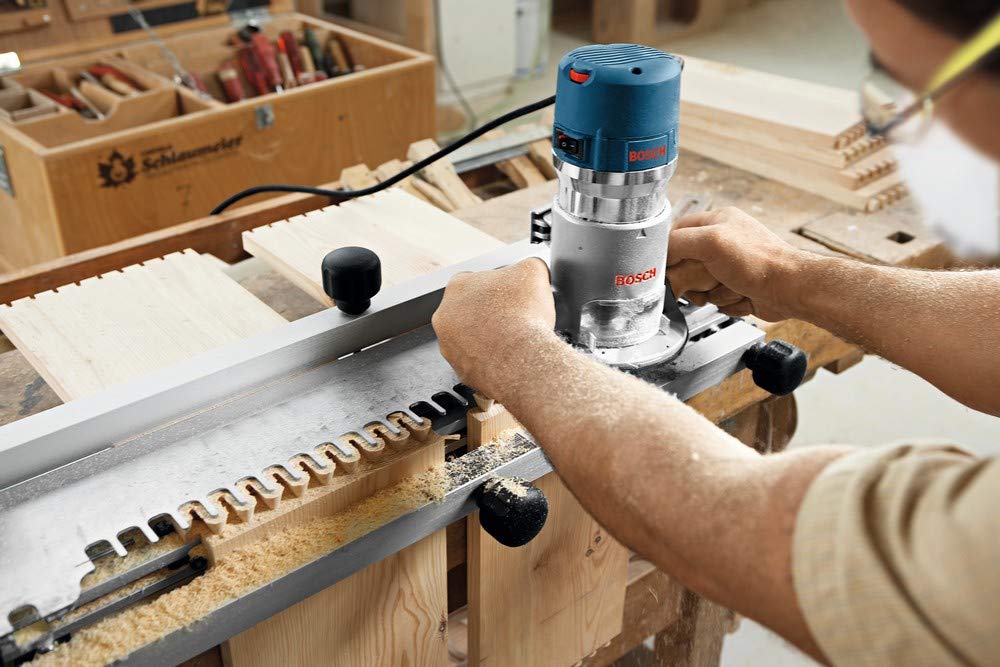 BOSCH 1617EVS 2.25 HP Electronic Fixed-Base Router and RA1171 25-1/2 in. x 15-7/8 in. Benchtop Laminated MDF Top Cabinet Style Router Table Bundle