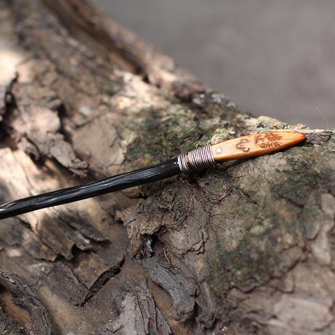 a close-up of a wooden hair stick