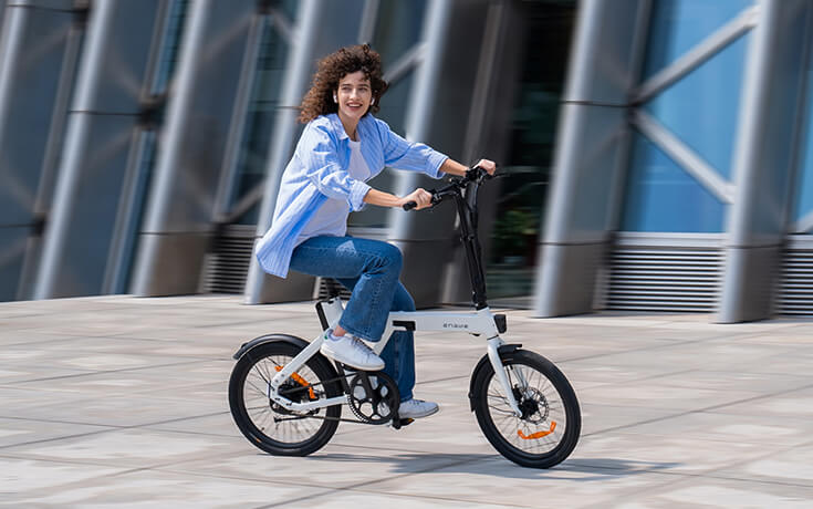 a woman riding an engwe p20 commuter e bike