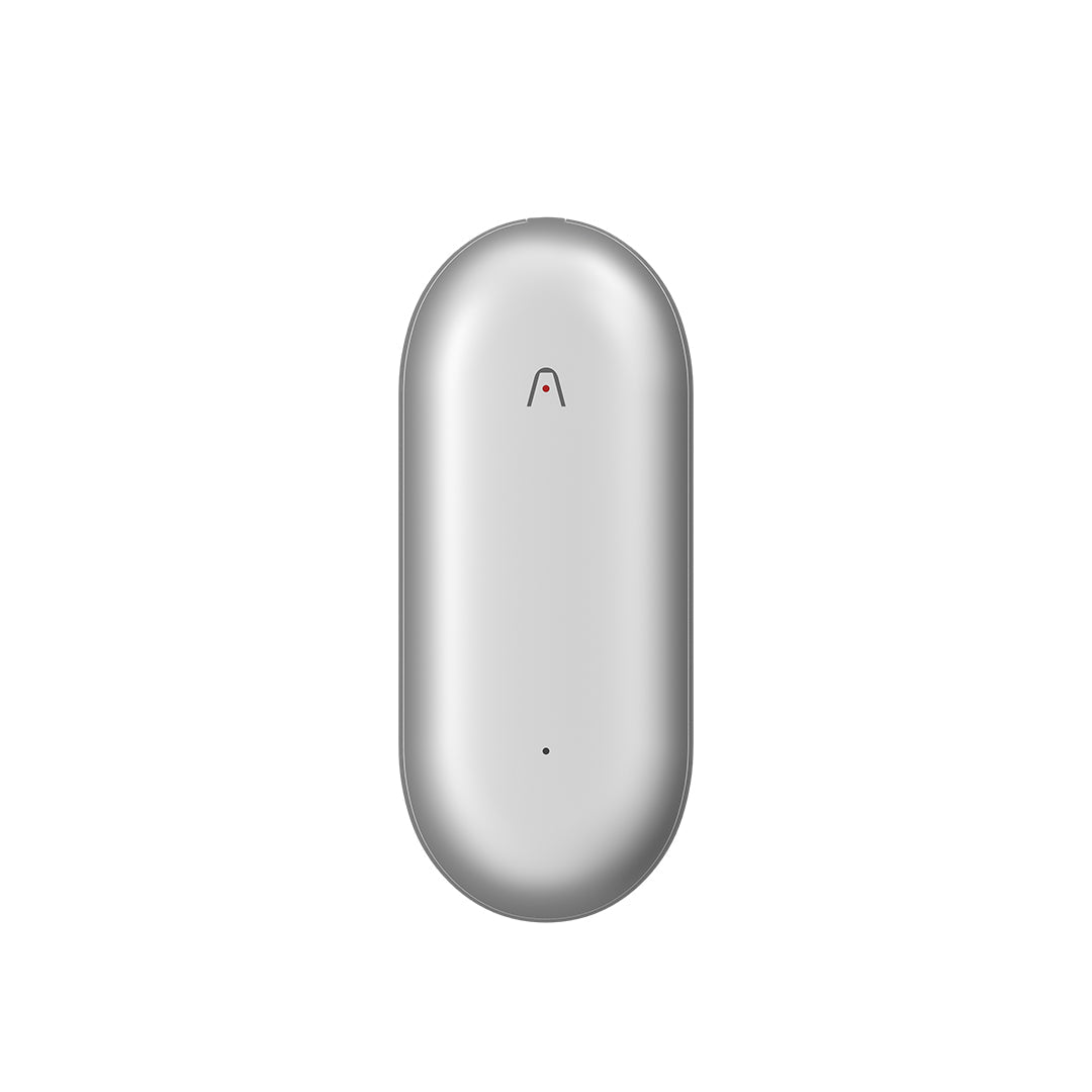 Silver Plaud NotePin wearable AI voice recorder in a capsule shape.
