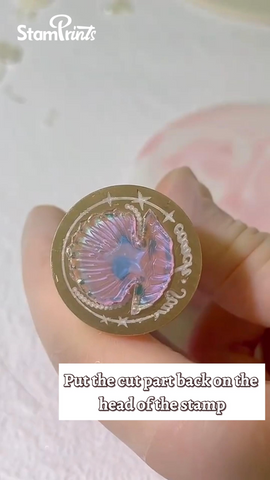 put the cut part back on the head of the stamp