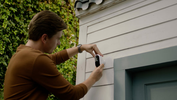 A Man Installing WUUK Outdoor Screw-in Camera