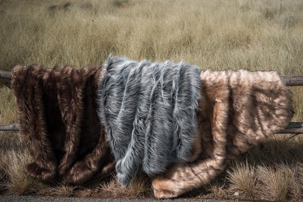 There are three kinds of faux fur throw blankets, brown, grey and golden. They're extremely soft and easy to care for.