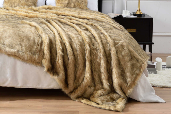 A golden faux fur throw blanket on the bed. Can also be used as faux fur duvet cover. Easy to clean and keep warm. Queen size and king size are available.
