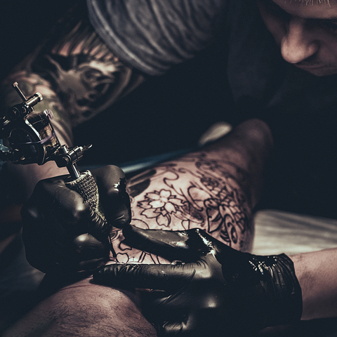 Tattorist Working with Tattoo Machine