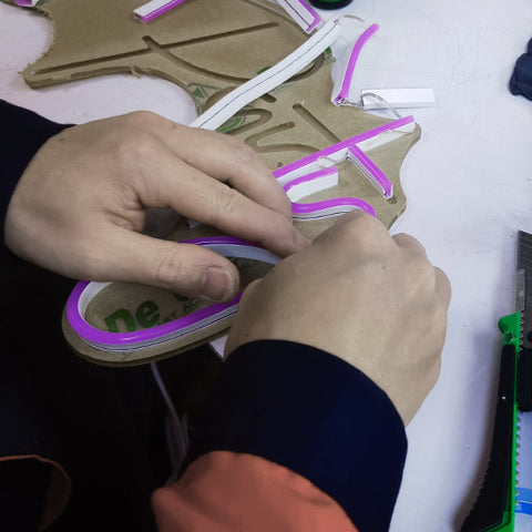 cutting neon sign