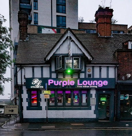 the purple launge sign