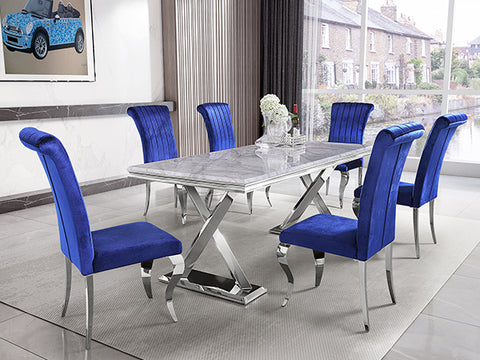 Title: Elevate Your Dining Experience with Blue Velvet Dining Chairs  Introduction: When it comes to creating a stylish and comfortable dining space, the right choice of furniture can make all the difference. If you're looking to add a touch of luxury and sophistication to your dining area, the AUZ Blue Velvet Dining Chairs with Silver Mirrored Stainless Steel Legs are the perfect choice. In this blog post, we will explore the benefits of these exquisite chairs and provide some suggestions on how to style them in your home.  Luxurious Feel and Elegant Design: The first notable benefit of these blue velvet dining chairs is the luxurious feel they offer. The delicate touch and elegant luster of the velvet upholstery create a sense of opulence that enhances every dining experience. The high-quality sponge-filled cushioned seat ensures maximum comfort, allowing you and your guests to enjoy lengthy meals without discomfort.  Stylish and Sturdy Construction: Apart from the luxurious feel, these chairs also boast a stylish and sturdy design. The cool tones of blue used in the velvet upholstery beautifully complement the metallic sheen of the polished silver stainless steel legs, resulting in a visually striking and sophisticated look. Furthermore, the curved legs add a touch of elegance and modernity to any room. The use of durable and textured stainless steel ensures longevity, making them a worthwhile investment.  Endless Versatility: The timeless appeal of blue makes these chairs incredibly versatile. Whether you're aiming for a classic, contemporary, or eclectic aesthetic, the blue velvet upholstery provides a chic and bold statement. Additionally, the silver mirrored steel legs add a touch of simplicity and elegance, making these chairs suitable for formal dinners as well as casual gatherings. They effortlessly blend into various design schemes and create a harmonious balance in any dining area.  Styling Suggestions: 1. Contemporary Elegance: Pair your blue velvet dining chairs with a sleek glass or marble dining table. Add a statement chandelier above the table and accentuate the modern look with minimalistic decor elements like geometric-shaped vases and metallic candle holders.  2. Eclectic Charm: Mix and match different chair colors, such as blue and green velvet, for a vibrant and eclectic dining space. Combine your chairs with a distressed wooden table and incorporate playful patterns in your table linens and accessories. Don't be afraid to experiment with bold colors and unique artwork on the walls.  3. Timeless Sophistication: Create a classic and sophisticated dining space by pairing these chairs with a polished wooden table. Opt for neutral-toned table linens and add some refined tableware to complete the elegant look. Enhance the ambiance with soft lighting and tasteful artwork on the walls.  Conclusion: Upgrade your dining experience with the AUZ Blue Velvet Dining Chairs with Silver Mirrored Stainless Steel Legs. These chairs offer a luxurious feel, elegant design, and sturdy construction. Whether you prefer a contemporary, eclectic, or timeless aesthetic, these blue velvet chairs effortlessly complement any style and create a captivating dining space. Treat yourself and your guests to the ultimate comfort, style, and sophistication with these exquisite dining chairs.