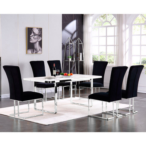 Step into luxury with our stunning dining set, a harmonious blend of comfort and modern appeal that will transform your dining room into a sleek, sophisticated space. Encased in plush black velvet, our dining chairs boast a strikingly curved high backrest that offers both an aesthetically pleasing contour and exceptional comfort. The silver metal sled base and polished frames accentuate their elegant form while ensuring robust support. Complementing the chairs, the stately dining table stands proud with its pristine 71-inch white slate tabletop. Anchored by a sleek silver metal U base, it echoes the chairs' lustrous appeal, and its matching silver base metal frame unifies the ensemble. This dining set not only sparkles as the centerpiece of your dining area but also sets the stage for unforgettable moments and everyday elegance.