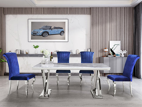 Title: Elevate Your Dining Experience with Blue Velvet Dining Chairs Introduction: When it comes to creating a stylish and comfortable dining space, the right choice of furniture can make all the difference. If you're looking to add a touch of luxury and sophistication to your dining area, the AUZ Blue Velvet Dining Chairs with Silver Mirrored Stainless Steel Legs are the perfect choice. In this blog post, we will explore the benefits of these exquisite chairs and provide some suggestions on how to style them in your home. Luxurious Feel and Elegant Design: The first notable benefit of these blue velvet dining chairs is the luxurious feel they offer. The delicate touch and elegant luster of the velvet upholstery create a sense of opulence that enhances every dining experience. The high-quality sponge-filled cushioned seat ensures maximum comfort, allowing you and your guests to enjoy lengthy meals without discomfort. Stylish and Sturdy Construction: Apart from the luxurious feel, these chairs also boast a stylish and sturdy design. The cool tones of blue used in the velvet upholstery beautifully complement the metallic sheen of the polished silver stainless steel legs, resulting in a visually striking and sophisticated look. Furthermore, the curved legs add a touch of elegance and modernity to any room. The use of durable and textured stainless steel ensures longevity, making them a worthwhile investment. Endless Versatility: The timeless appeal of blue makes these chairs incredibly versatile. Whether you're aiming for a classic, contemporary, or eclectic aesthetic, the blue velvet upholstery provides a chic and bold statement. Additionally, the silver mirrored steel legs add a touch of simplicity and elegance, making these chairs suitable for formal dinners as well as casual gatherings. They effortlessly blend into various design schemes and create a harmonious balance in any dining area. Styling Suggestions: 1. Contemporary Elegance: Pair your blue velvet dining chairs with a sleek glass or marble dining table. Add a statement chandelier above the table and accentuate the modern look with minimalistic decor elements like geometric-shaped vases and metallic candle holders. 2. Eclectic Charm: Mix and match different chair colors, such as blue and green velvet, for a vibrant and eclectic dining space. Combine your chairs with a distressed wooden table and incorporate playful patterns in your table linens and accessories. Don't be afraid to experiment with bold colors and unique artwork on the walls. 3. Timeless Sophistication: Create a classic and sophisticated dining space by pairing these chairs with a polished wooden table. Opt for neutral-toned table linens and add some refined tableware to complete the elegant look. Enhance the ambiance with soft lighting and tasteful artwork on the walls. Conclusion: Upgrade your dining experience with the AUZ Blue Velvet Dining Chairs with Silver Mirrored Stainless Steel Legs. These chairs offer a luxurious feel, elegant design, and sturdy construction. Whether you prefer a contemporary, eclectic, or timeless aesthetic, these blue velvet chairs effortlessly complement any style and create a captivating dining space. Treat yourself and your guests to the ultimate comfort, style, and sophistication with these exquisite dining chairs.
