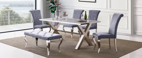 Title: Elevate Your Dining Space with Gray Velvet Dining Chairs Introduction: In the world of interior design, the right choice of dining chairs can transform a dining space from ordinary to extraordinary. If you're looking to add a touch of elegance and sophistication to your dining area, the AUZ Gray Velvet Dining Chairs with Silver Mirrored Stainless Steel Legs are a perfect choice. In this blog post, we will explore the advantages of these exquisite chairs and provide some suggestions on how to style them in your home. Impressive and Stylish Design: The first notable advantage of these gray velvet dining chairs is their impressive and stylish design. The combination of the soft gray velvet upholstery and the sleek silver metal legs creates a visually striking impression. The vertical texture and curled backrest add a sense of dimension and sophistication to the chairs, making them a focal point in any dining space. Comfortable and Supportive Upholstery: Apart from their aesthetic appeal, these chairs also offer exceptional comfort and support. The velvet upholstery combined with the gentle sponge cushioning provides a soft and cozy seating experience. The curved backrest not only enhances the visual appeal but also provides adequate support for your back during meals. You and your guests can enjoy long conversations and delightful meals without any discomfort. Durable and Elegant Construction: The AUZ Gray Velvet Dining Chairs are not only stylish but also built to last. The exquisite cabriole front legs and slightly bent backward rear legs showcase both durability and elegance. The polished silver mirrored stainless steel legs not only provide sturdy support but also add a touch of modern sophistication to your dining space. The combination of these design elements creates a chair that is both functional and visually appealing. Versatile and Styling Suggestions: 1. Monochromatic Elegance: Create an elegant and sophisticated dining space by pairing these gray velvet chairs with a marble or glass dining table. Keep the color palette monochromatic by incorporating silver or metallic accents in the tableware and decor. Add subtle pops of color with fresh flowers or vibrant table linens for a tasteful touch. 2. Modern Chic: Embrace a modern and chic dining aesthetic by pairing these gray velvet chairs with a sleek, minimalist dining table. Opt for a white or light-colored table and keep the decor clean and streamlined. Add geometric-shaped pendant lights and abstract artwork on the walls to create a trendy and fashionable space. 3. Cozy and Warm: If you prefer a cozy and warm atmosphere, pair these gray velvet chairs with a rustic wooden dining table. Incorporate earth tones and natural textures in the table linens and accessories. Add a touch of warmth with soft lighting, such as candlelight or warm-toned pendant lights, to create an inviting ambiance. Conclusion: The AUZ Gray Velvet Dining Chairs with Silver Mirrored Stainless Steel Legs offer a perfect balance of style, comfort, and durability. Their impressive design, comfortable upholstery, and elegant construction make them an excellent addition to any dining space. Whether you prefer an elegant and sophisticated look or a modern and chic aesthetic, these gray velvet chairs are versatile enough to complement a range of interior design styles. Elevate your dining experience by incorporating these exquisite chairs and create a space that exudes elegance and comfort.
