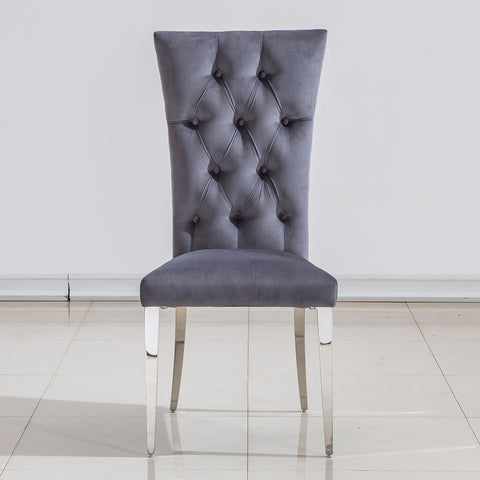 Title: Elevate Your Dining Experience with Grey Velvet Upholstered Chairs Introduction: When it comes to creating a stylish and inviting dining area, the right furniture plays a crucial role. Grey velvet upholstered dining room chairs with button-tufted back and silver stainless steel legs are an excellent choice to add a touch of luxury and comfort to your dining space. In this blog post, we will explore the benefits of these elegant chairs and how they can enhance your dining experience. 1. Exquisite and Luxurious Appearance: The craftsmanship on the upholstery and button-tufted back gives these dining chairs a luxurious and elegant look. The concise and vogue lines add a sense of sophistication to your dining area, making it visually appealing. The exquisite design and beautiful grey velvet upholstery elevate the overall aesthetics of the space, creating a stylish and refined ambiance. 2. High Backrest for Enhanced Comfort: These dining chairs are designed with a high backrest, providing excellent support and comfort during meals. The generous backrest not only offers a comfortable seating experience but also promotes good posture. Whether you are enjoying a leisurely dinner or engaging in lively conversations with family and friends, the high backrest ensures that you can sit back and relax in utmost comfort. 3. Gorgeous Silver Stainless Steel Legs: The silver stainless steel legs of these chairs are polished and have a mirror-like finish. This adds a modern and glamorous touch to the design, especially when illuminated by ambient lighting. The interplay of light and the polished metal legs creates a stunning visual effect, making these chairs a focal point in your dining area. Additionally, the stainless steel construction ensures sturdiness and durability, with a weight-bearing capacity of at least 550 lbs. 4. Cozy and Generous Seating: These grey velvet upholstered dining chairs not only provide a sense of hierarchy to your home decoration but also offer generous seating space. The high-quality lining and richly foam-padded seat and back ensure maximum comfort. The high elasticity of the padding provides a cushioning effect, allowing you to sit comfortably for extended periods. The easy-care brown tufted upholstery adds to the overall elegance while being practical and easy to clean. Conclusion: Incorporating grey velvet upholstered dining room chairs with button tufted back and silver stainless steel legs can transform your dining area into a luxurious and inviting space. These chairs offer a perfect blend of style and comfort, with their elegant appearance and high backrest providing optimum support. The mirror-like finish of the silver stainless steel legs adds a touch of modernity, making these chairs a visual delight in any lighting condition. Elevate your dining experience and create lasting memories with these exquisite grey velvet dining chairs.