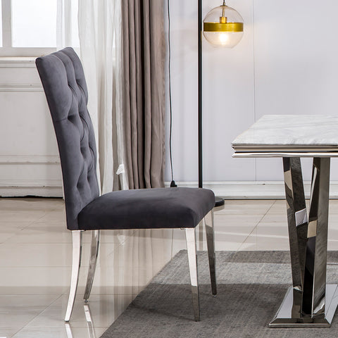 Title: Elevate Your Dining Experience with Grey Velvet Upholstered Chairs Introduction: When it comes to creating a stylish and inviting dining area, the right furniture plays a crucial role. Grey velvet upholstered dining room chairs with button-tufted back and silver stainless steel legs are an excellent choice to add a touch of luxury and comfort to your dining space. In this blog post, we will explore the benefits of these elegant chairs and how they can enhance your dining experience. 1. Exquisite and Luxurious Appearance: The craftsmanship on the upholstery and button-tufted back gives these dining chairs a luxurious and elegant look. The concise and vogue lines add a sense of sophistication to your dining area, making it visually appealing. The exquisite design and beautiful grey velvet upholstery elevate the overall aesthetics of the space, creating a stylish and refined ambiance. 2. High Backrest for Enhanced Comfort: These dining chairs are designed with a high backrest, providing excellent support and comfort during meals. The generous backrest not only offers a comfortable seating experience but also promotes good posture. Whether you are enjoying a leisurely dinner or engaging in lively conversations with family and friends, the high backrest ensures that you can sit back and relax in utmost comfort. 3. Gorgeous Silver Stainless Steel Legs: The silver stainless steel legs of these chairs are polished and have a mirror-like finish. This adds a modern and glamorous touch to the design, especially when illuminated by ambient lighting. The interplay of light and the polished metal legs creates a stunning visual effect, making these chairs a focal point in your dining area. Additionally, the stainless steel construction ensures sturdiness and durability, with a weight-bearing capacity of at least 550 lbs. 4. Cozy and Generous Seating: These grey velvet upholstered dining chairs not only provide a sense of hierarchy to your home decoration but also offer generous seating space. The high-quality lining and richly foam-padded seat and back ensure maximum comfort. The high elasticity of the padding provides a cushioning effect, allowing you to sit comfortably for extended periods. The easy-care brown tufted upholstery adds to the overall elegance while being practical and easy to clean. Conclusion: Incorporating grey velvet upholstered dining room chairs with button tufted back and silver stainless steel legs can transform your dining area into a luxurious and inviting space. These chairs offer a perfect blend of style and comfort, with their elegant appearance and high backrest providing optimum support. The mirror-like finish of the silver stainless steel legs adds a touch of modernity, making these chairs a visual delight in any lighting condition. Elevate your dining experience and create lasting memories with these exquisite grey velvet dining chairs.