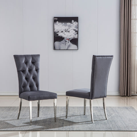 Title: Elevate Your Dining Experience with Grey Velvet Upholstered Chairs Introduction: When it comes to creating a stylish and inviting dining area, the right furniture plays a crucial role. Grey velvet upholstered dining room chairs with button-tufted back and silver stainless steel legs are an excellent choice to add a touch of luxury and comfort to your dining space. In this blog post, we will explore the benefits of these elegant chairs and how they can enhance your dining experience. 1. Exquisite and Luxurious Appearance: The craftsmanship on the upholstery and button-tufted back gives these dining chairs a luxurious and elegant look. The concise and vogue lines add a sense of sophistication to your dining area, making it visually appealing. The exquisite design and beautiful grey velvet upholstery elevate the overall aesthetics of the space, creating a stylish and refined ambiance. 2. High Backrest for Enhanced Comfort: These dining chairs are designed with a high backrest, providing excellent support and comfort during meals. The generous backrest not only offers a comfortable seating experience but also promotes good posture. Whether you are enjoying a leisurely dinner or engaging in lively conversations with family and friends, the high backrest ensures that you can sit back and relax in utmost comfort. 3. Gorgeous Silver Stainless Steel Legs: The silver stainless steel legs of these chairs are polished and have a mirror-like finish. This adds a modern and glamorous touch to the design, especially when illuminated by ambient lighting. The interplay of light and the polished metal legs creates a stunning visual effect, making these chairs a focal point in your dining area. Additionally, the stainless steel construction ensures sturdiness and durability, with a weight-bearing capacity of at least 550 lbs. 4. Cozy and Generous Seating: These grey velvet upholstered dining chairs not only provide a sense of hierarchy to your home decoration but also offer generous seating space. The high-quality lining and richly foam-padded seat and back ensure maximum comfort. The high elasticity of the padding provides a cushioning effect, allowing you to sit comfortably for extended periods. The easy-care brown tufted upholstery adds to the overall elegance while being practical and easy to clean. Conclusion: Incorporating grey velvet upholstered dining room chairs with button tufted back and silver stainless steel legs can transform your dining area into a luxurious and inviting space. These chairs offer a perfect blend of style and comfort, with their elegant appearance and high backrest providing optimum support. The mirror-like finish of the silver stainless steel legs adds a touch of modernity, making these chairs a visual delight in any lighting condition. Elevate your dining experience and create lasting memories with these exquisite grey velvet dining chairs.