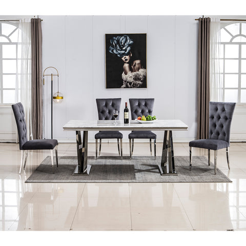 Title: Elevate Your Dining Experience with Grey Velvet Upholstered Chairs Introduction: When it comes to creating a stylish and inviting dining area, the right furniture plays a crucial role. Grey velvet upholstered dining room chairs with button-tufted back and silver stainless steel legs are an excellent choice to add a touch of luxury and comfort to your dining space. In this blog post, we will explore the benefits of these elegant chairs and how they can enhance your dining experience. 1. Exquisite and Luxurious Appearance: The craftsmanship on the upholstery and button-tufted back gives these dining chairs a luxurious and elegant look. The concise and vogue lines add a sense of sophistication to your dining area, making it visually appealing. The exquisite design and beautiful grey velvet upholstery elevate the overall aesthetics of the space, creating a stylish and refined ambiance. 2. High Backrest for Enhanced Comfort: These dining chairs are designed with a high backrest, providing excellent support and comfort during meals. The generous backrest not only offers a comfortable seating experience but also promotes good posture. Whether you are enjoying a leisurely dinner or engaging in lively conversations with family and friends, the high backrest ensures that you can sit back and relax in utmost comfort. 3. Gorgeous Silver Stainless Steel Legs: The silver stainless steel legs of these chairs are polished and have a mirror-like finish. This adds a modern and glamorous touch to the design, especially when illuminated by ambient lighting. The interplay of light and the polished metal legs creates a stunning visual effect, making these chairs a focal point in your dining area. Additionally, the stainless steel construction ensures sturdiness and durability, with a weight-bearing capacity of at least 550 lbs. 4. Cozy and Generous Seating: These grey velvet upholstered dining chairs not only provide a sense of hierarchy to your home decoration but also offer generous seating space. The high-quality lining and richly foam-padded seat and back ensure maximum comfort. The high elasticity of the padding provides a cushioning effect, allowing you to sit comfortably for extended periods. The easy-care brown tufted upholstery adds to the overall elegance while being practical and easy to clean. Conclusion: Incorporating grey velvet upholstered dining room chairs with button tufted back and silver stainless steel legs can transform your dining area into a luxurious and inviting space. These chairs offer a perfect blend of style and comfort, with their elegant appearance and high backrest providing optimum support. The mirror-like finish of the silver stainless steel legs adds a touch of modernity, making these chairs a visual delight in any lighting condition. Elevate your dining experience and create lasting memories with these exquisite grey velvet dining chairs.