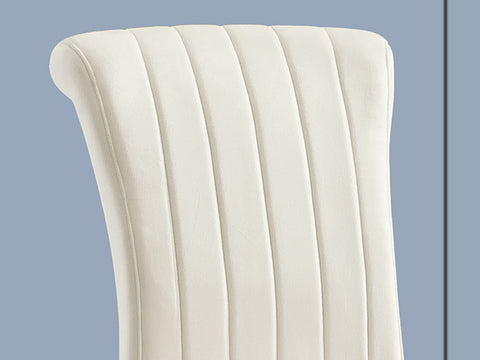 Title: Enhance Your Dining Space with AUZ Beige Velvet Dining Room Chairs in Vertical Texture High Back  Introduction: When it comes to designing your dining space, finding the perfect combination of style, comfort, and durability is essential. AUZ presents its Beige Velvet Dining Room Chairs in Vertical Texture High Back, upholstered with silver mirrored stainless steel legs. This stylishly designed chair not only adds a touch of sophistication to your dining area but also provides a comfortable seating experience. Let's delve deeper into the features that make these chairs an excellent choice for your dining room.  Stylish Design: The AUZ Beige Velvet Dining Room Chairs captivate attention with their impressive design. The combination of beige velvet upholstery and silver metal legs creates a visually striking appearance. The vertical texture and curled backrest add a strong sense of dimension and elegance to the chairs. With their sleek and modern design, these chairs seamlessly blend into any contemporary dining space.  Velvet Upholstery for Comfort: One of the standout features of these dining chairs is the soft cushion made of high-quality velvet and a gentle sponge. This upholstery ensures utmost comfort and support while you enjoy your meals. The plush velvet texture adds a touch of luxury to the dining experience, making it even more enjoyable.  Polished Metal Legs: Built to last, the AUZ Beige Velvet Dining Room Chairs feature exquisite cabriole front legs and slightly bent backward rear legs made of silver mirrored stainless steel. These polished metal legs not only add to the chair's elegance but also provide sturdy support. Their durable construction ensures that these chairs will withstand regular use.  Kitchen & Dining Room Chairs: The AUZ Beige Velvet Dining Room Chairs have a weight capacity of 550 LB, making them suitable for various body types. Whether you're hosting a small gathering or a large dinner party, these chairs can accommodate all your guests' needs. Their modern style and sophisticated design elevate the overall aesthetic of your dining space.  A Perfect Match: To complete the harmonious look, AUZ also offers matching dining room benches in the same style as the dining chairs. This cohesive set ensures that your dining area is visually appealing and cohesive in design. By combining the AUZ Beige Velvet Dining Room Chairs and benches, you create a truly captivating and stylish atmosphere.  Conclusion: If you're seeking dining chairs that are not only visually stunning but also provide optimal comfort and durability, the AUZ Beige Velvet Dining Room Chairs in Vertical Texture High Back are an ideal choice. With their stylish design, velvet upholstery, and polished metal legs, these chairs elevate any dining space, adding a touch of sophistication. Additionally, the matching benches further enhance the overall aesthetic appeal of your dining area. Make a statement in style with AUZ dining chairs and create a dining experience that is both comfortable and visually impressive.