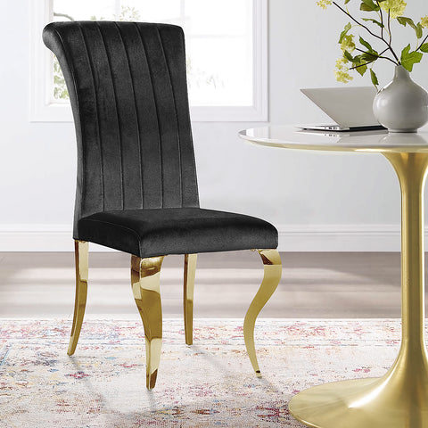 Elevate Your Dining Space with AUZ Black Velvet Dining Chairs and Gold Mirrored Legs  Upgrade your dining experience with AUZ Black Velvet Dining Chairs. Discover the perfect combination of modern luxury and exquisite style in these stunning chairs that effortlessly transform any dining space.  Luxurious Design: AUZ Black Velvet Dining Chairs feature a sleek and glamorous design. The black velvet upholstery paired with gold mirrored stainless steel legs creates an atmosphere of sophistication and calm. This combination of colors and textures adds a touch of elegance to your dining room.  Comfortable Seating: Sink into the softness of these chairs' plush velvet upholstery. The vertical texture and curved backrest not only make a visual statement but also provide exceptional comfort and support. With AUZ Black Velvet Dining Chairs, you can enjoy long hours of dining or entertaining in utmost comfort.  Durable Construction: Crafted with precision and attention to detail, these chairs boast exquisite cabriole front legs and slightly bent backward rear legs made of gold mirrored stainless steel. The polished metal legs not only enhance the chair's elegance but also ensure durability and stability.  Versatile Style: The AUZ Black Velvet Dining Chairs effortlessly blend with various decor styles, making them a versatile choice for any dining space. Whether your interior design is modern or traditional, these chairs will seamlessly complement your existing decor, creating a cohesive and visually stunning atmosphere.  Perfect for Entertaining: With a weight capacity of 550 LB, these chairs are designed to accommodate your guests comfortably. Whether you're hosting a formal dinner party or enjoying everyday meals with your family, AUZ Black Velvet Dining Chairs will elevate every dining experience.  Conclusion: Elevate your dining space with AUZ Black Velvet Dining Chairs and their gold mirrored stainless steel legs. The luxurious design, comfortable seating, and durable construction make these chairs the epitome of modern elegance. Whether you're hosting a lavish dinner party or simply enjoying meals with your loved ones, AUZ Black Velvet Dining Chairs will enhance your dining experience and impress your guests. Upgrade your dining space today and indulge in the perfect combination of style and comfort.