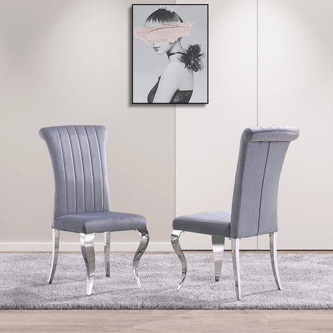 Title: Elevate Your Dining Space with Gray Velvet Dining Chairs Introduction: In the world of interior design, the right choice of dining chairs can transform a dining space from ordinary to extraordinary. If you're looking to add a touch of elegance and sophistication to your dining area, the AUZ Gray Velvet Dining Chairs with Silver Mirrored Stainless Steel Legs are a perfect choice. In this blog post, we will explore the advantages of these exquisite chairs and provide some suggestions on how to style them in your home. Impressive and Stylish Design: The first notable advantage of these gray velvet dining chairs is their impressive and stylish design. The combination of the soft gray velvet upholstery and the sleek silver metal legs creates a visually striking impression. The vertical texture and curled backrest add a sense of dimension and sophistication to the chairs, making them a focal point in any dining space. Comfortable and Supportive Upholstery: Apart from their aesthetic appeal, these chairs also offer exceptional comfort and support. The velvet upholstery combined with the gentle sponge cushioning provides a soft and cozy seating experience. The curved backrest not only enhances the visual appeal but also provides adequate support for your back during meals. You and your guests can enjoy long conversations and delightful meals without any discomfort. Durable and Elegant Construction: The AUZ Gray Velvet Dining Chairs are not only stylish but also built to last. The exquisite cabriole front legs and slightly bent backward rear legs showcase both durability and elegance. The polished silver mirrored stainless steel legs not only provide sturdy support but also add a touch of modern sophistication to your dining space. The combination of these design elements creates a chair that is both functional and visually appealing. Versatile and Styling Suggestions: 1. Monochromatic Elegance: Create an elegant and sophisticated dining space by pairing these gray velvet chairs with a marble or glass dining table. Keep the color palette monochromatic by incorporating silver or metallic accents in the tableware and decor. Add subtle pops of color with fresh flowers or vibrant table linens for a tasteful touch. 2. Modern Chic: Embrace a modern and chic dining aesthetic by pairing these gray velvet chairs with a sleek, minimalist dining table. Opt for a white or light-colored table and keep the decor clean and streamlined. Add geometric-shaped pendant lights and abstract artwork on the walls to create a trendy and fashionable space. 3. Cozy and Warm: If you prefer a cozy and warm atmosphere, pair these gray velvet chairs with a rustic wooden dining table. Incorporate earth tones and natural textures in the table linens and accessories. Add a touch of warmth with soft lighting, such as candlelight or warm-toned pendant lights, to create an inviting ambiance. Conclusion: The AUZ Gray Velvet Dining Chairs with Silver Mirrored Stainless Steel Legs offer a perfect balance of style, comfort, and durability. Their impressive design, comfortable upholstery, and elegant construction make them an excellent addition to any dining space. Whether you prefer an elegant and sophisticated look or a modern and chic aesthetic, these gray velvet chairs are versatile enough to complement a range of interior design styles. Elevate your dining experience by incorporating these exquisite chairs and create a space that exudes elegance and comfort.