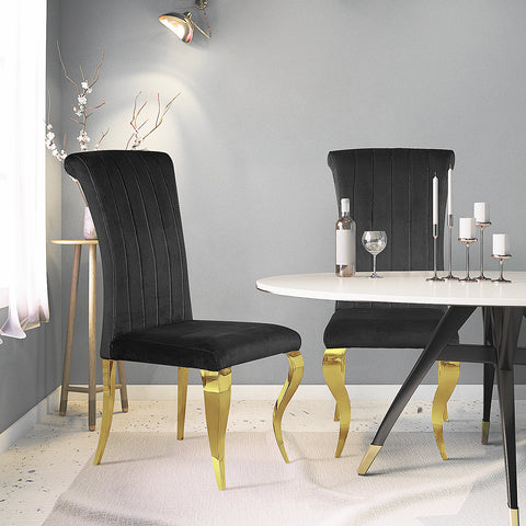 Elevate Your Dining Space with AUZ Black Velvet Dining Chairs and Gold Mirrored Legs  Upgrade your dining experience with AUZ Black Velvet Dining Chairs. Discover the perfect combination of modern luxury and exquisite style in these stunning chairs that effortlessly transform any dining space.  Luxurious Design: AUZ Black Velvet Dining Chairs feature a sleek and glamorous design. The black velvet upholstery paired with gold mirrored stainless steel legs creates an atmosphere of sophistication and calm. This combination of colors and textures adds a touch of elegance to your dining room.  Comfortable Seating: Sink into the softness of these chairs' plush velvet upholstery. The vertical texture and curved backrest not only make a visual statement but also provide exceptional comfort and support. With AUZ Black Velvet Dining Chairs, you can enjoy long hours of dining or entertaining in utmost comfort.  Durable Construction: Crafted with precision and attention to detail, these chairs boast exquisite cabriole front legs and slightly bent backward rear legs made of gold mirrored stainless steel. The polished metal legs not only enhance the chair's elegance but also ensure durability and stability.  Versatile Style: The AUZ Black Velvet Dining Chairs effortlessly blend with various decor styles, making them a versatile choice for any dining space. Whether your interior design is modern or traditional, these chairs will seamlessly complement your existing decor, creating a cohesive and visually stunning atmosphere.  Perfect for Entertaining: With a weight capacity of 550 LB, these chairs are designed to accommodate your guests comfortably. Whether you're hosting a formal dinner party or enjoying everyday meals with your family, AUZ Black Velvet Dining Chairs will elevate every dining experience.  Conclusion: Elevate your dining space with AUZ Black Velvet Dining Chairs and their gold mirrored stainless steel legs. The luxurious design, comfortable seating, and durable construction make these chairs the epitome of modern elegance. Whether you're hosting a lavish dinner party or simply enjoying meals with your loved ones, AUZ Black Velvet Dining Chairs will enhance your dining experience and impress your guests. Upgrade your dining space today and indulge in the perfect combination of style and comfort.