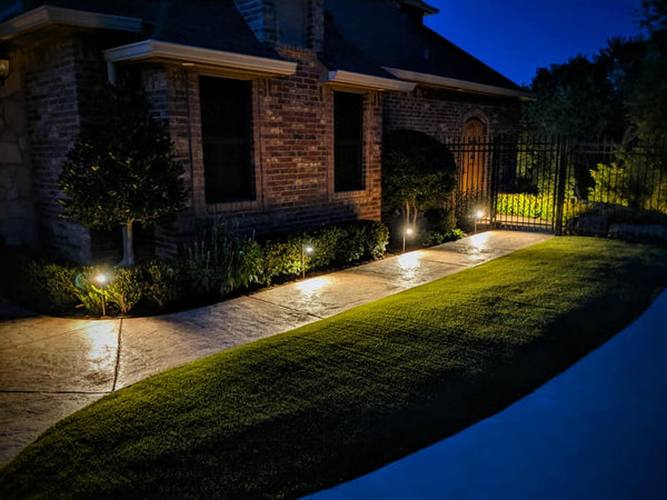 MALORY Brass Landscape Spotlight in Garden