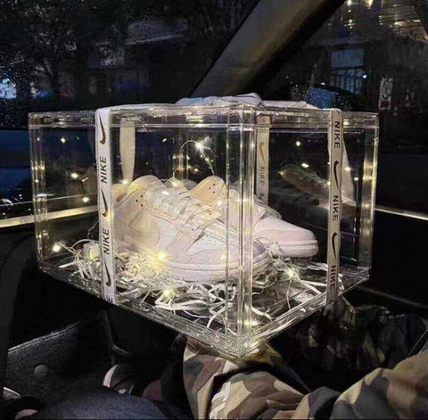 Elegant laser-cut acrylic shoe holders with delicate lacework patterns.