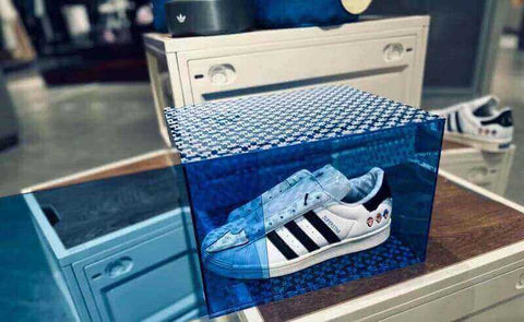 Dramatic light up acrylic shoe boxes with integrated LED lighting.