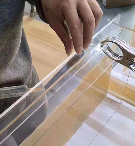 A complex 3D acrylic shape that has been bent into an S curve using professional bending equipment.