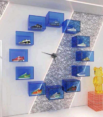 Organized shoe storage with customizable acrylic shoe box inserts featuring laser-cut slots.