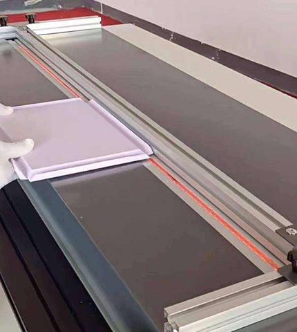 An acrylic sheet being laser cut to size prior to bending using a computer-guided laser cutter.