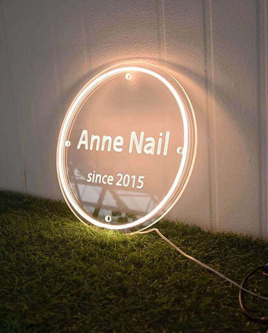 LED acrylic signs with backlighting showing a store name
