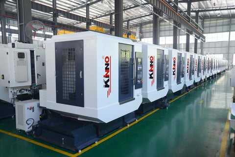 A 5-axis CNC machine in action, simultaneously moving and rotating to create a complex undercut feature on a high-performance plastic part for an aerospace application.