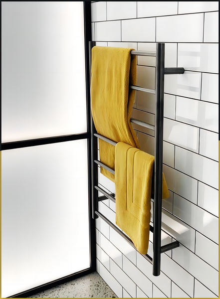 Glossy Stainless Steel Heated Towel Rack mounted on a bathroom wall