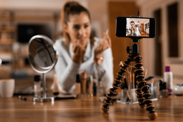 a woman is sharing cosmetic products through video